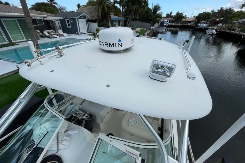 Slide: The Image of 2006 Hydra-Sports Vector 2900 VX boat with Garmin radar, docked by a canal. - 22