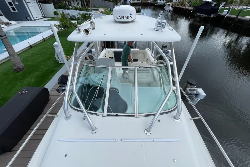 Slide: The Image of 2006 Hydra-Sports Vector 2900 VX boat docked by a canal with Garmin equipment. - 23