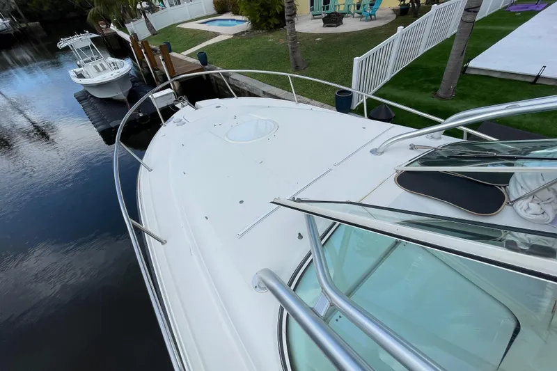 Slide: The Image of 2006 Hydra-Sports Vector 2900 VX boat docked by a waterfront property. - 25