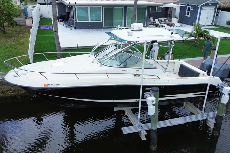 Slide: The Image of 2006 Hydra-Sports Vector 2900 VX boat docked near a waterfront home. - 3