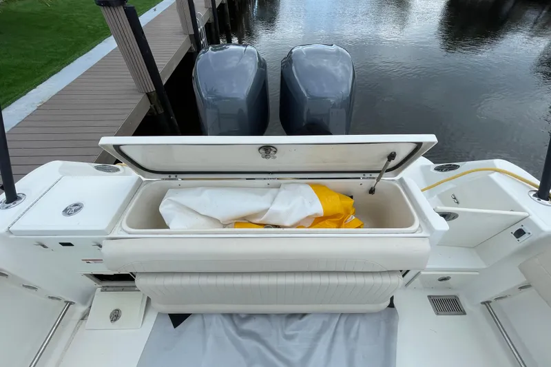 Slide: The Image of 2006 Hydra-Sports Vector 2900 VX boat with open storage compartment and twin engines. - 32