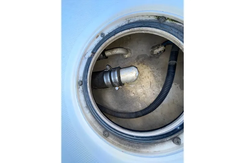 Slide: The Image of 2006 Hydra-Sports Vector 2900 VX boat compartment with hoses and fittings. - 45