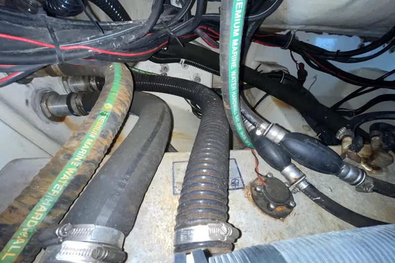 Slide: The Image of Engine compartment of a 2006 Hydra-Sports Vector 2900 VX with marine hoses and wiring. - 46