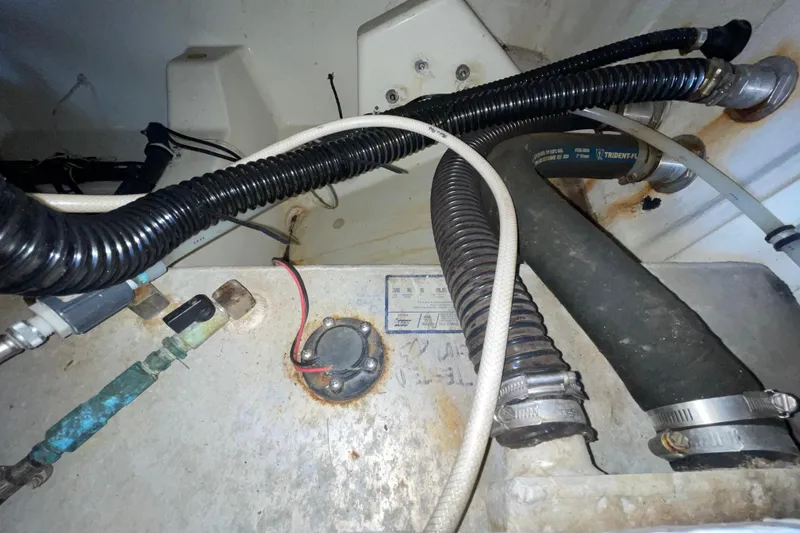 Slide: The Image of 2006 Hydra-Sports Vector 2900 VX boat interior showing hoses and wiring components. - 47
