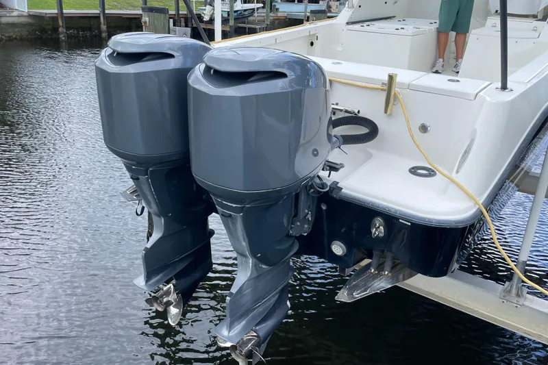 Slide: The Image of 2006 Hydra-Sports Vector 2900 VX with dual outboard motors on a lift. - 48