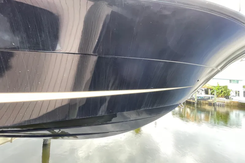 Slide: The Image of 2006 Hydra-Sports Vector 2900 VX boat hull reflecting on water. - 50