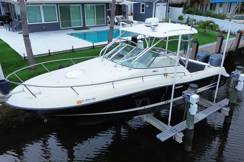 Slide: The Image of 2006 Hydra-Sports Vector 2900 VX boat docked near modern waterfront home. - 6