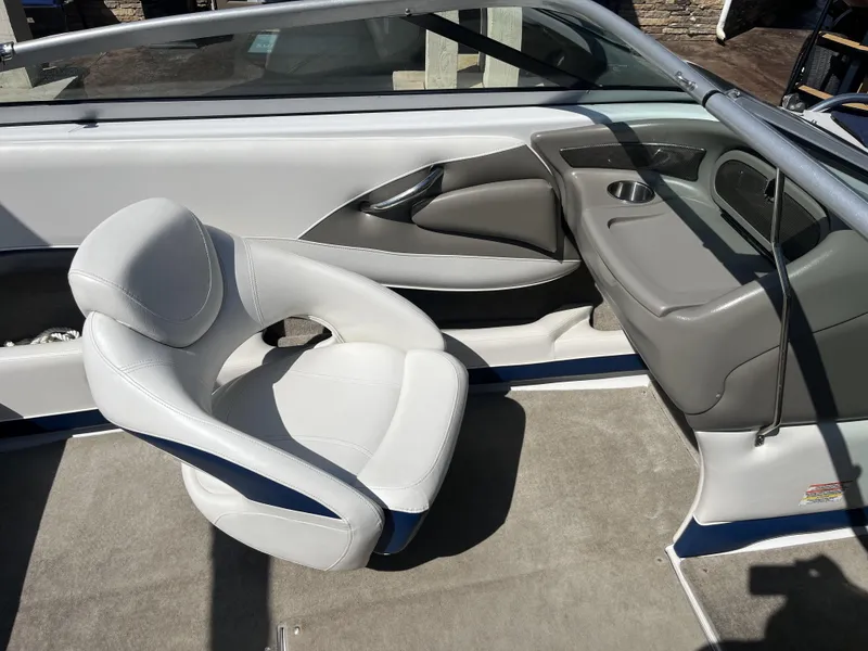 Slide: The Image of Interior of a 2008 Crownline 23 SS boat with gray seating. - 14