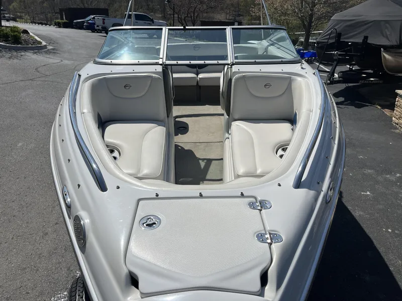 Slide: The Image of 2008 Crownline 23 SS boat with open cabin and seating. - 3