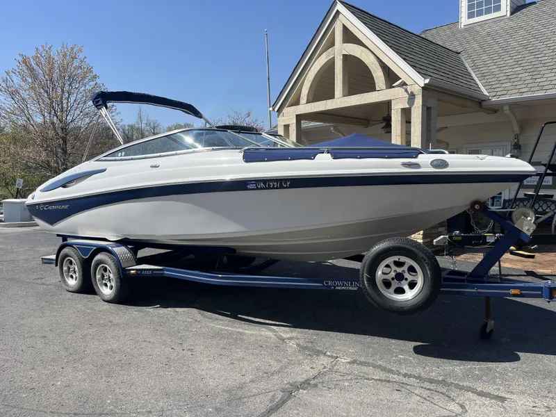 Slide: The Image of 2008 Crownline 23 SS boat on trailer in front of building. - 36