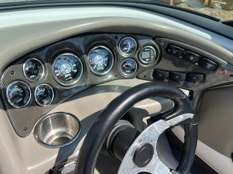 Slide: The Image of Dashboard of a 2008 Crownline 23 SS boat with gauges. - 42