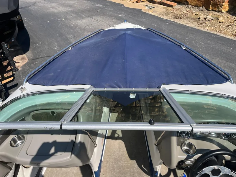 Slide: The Image of 2008 Crownline 23 SS boat with blue cover, interior view. - 47