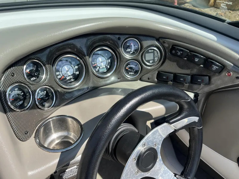 Slide: The Image of Dashboard of a 2008 Crownline 23 SS boat with gauges. - 8