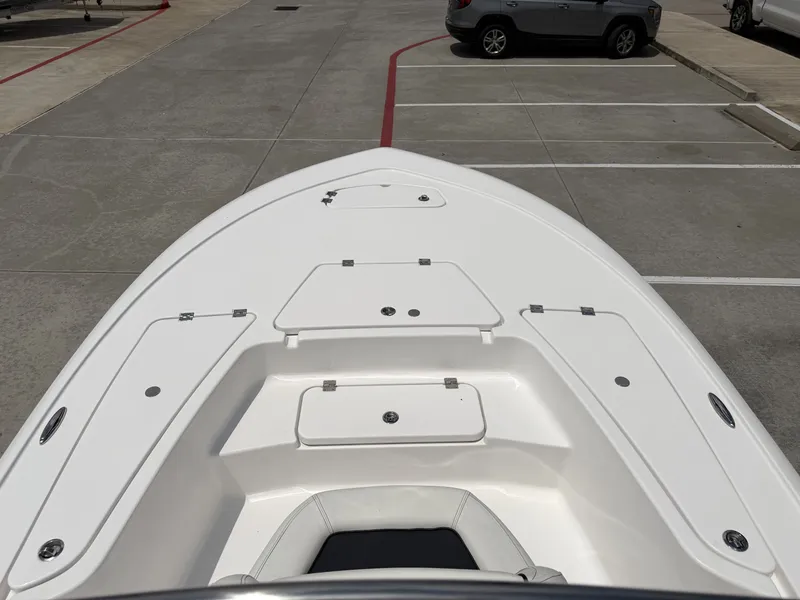 Slide: The Image of Front view of 2026 Tidewater 2110BMT boat deck in parking lot. - 17