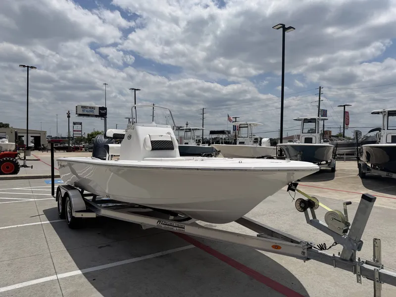 Slide: The Image of 2026 Tidewater 2110BMT boat displayed on trailer outdoors. - 3
