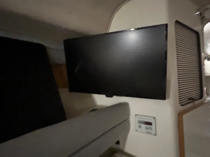 Slide: The Image of Interior of 1992 Sea Ray 370 Sundancer with mounted flat-screen TV. - 3