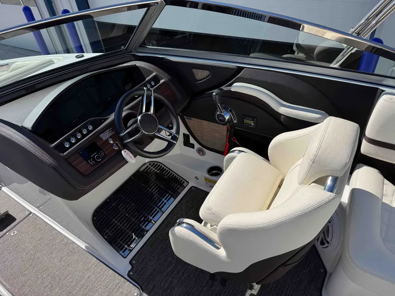 Slide: The Image of Interior of a 2021 Cobalt R5 boat with steering wheel and console. - 10