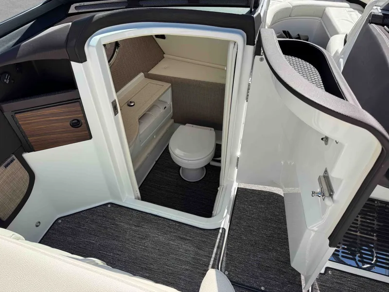 Slide: The Image of Interior of a 2021 Cobalt R5 featuring toilet and storage area. - 18