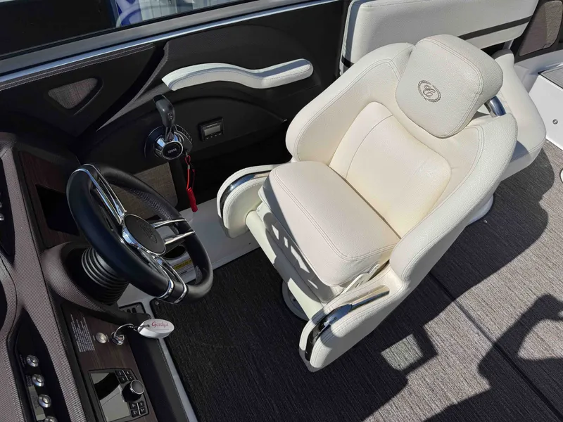 Slide: The Image of Interior of a 2021 Cobalt R5 boat with luxurious seat and steering wheel. - 21
