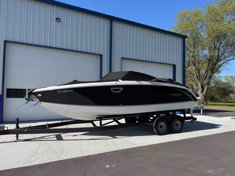 Slide: The Image of 2021 Cobalt R5 boat on trailer outside warehouse. - 32