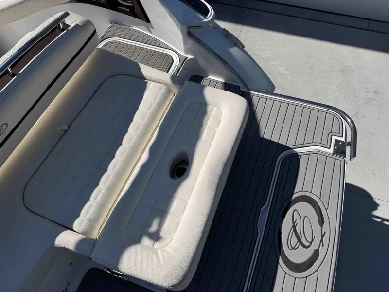 Slide: The Image of Cobalt R5 2021 boat stern with cushioned seat and gray flooring. - 6