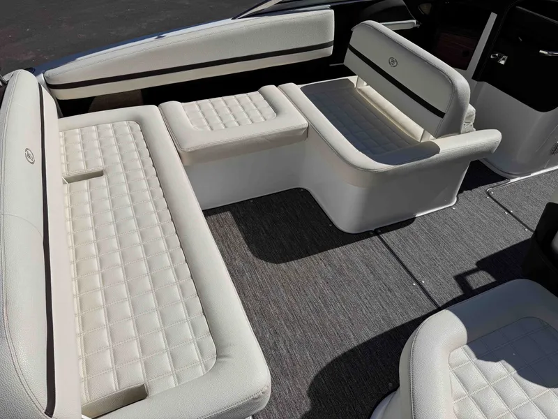 Slide: The Image of Interior of a 2021 Cobalt R5 boat with white upholstered seats. - 8