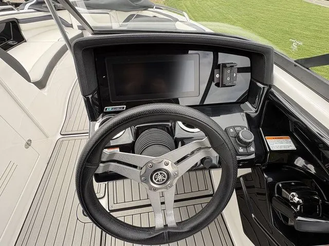 Slide: The Image of Yamaha Boats 2020 242 SE Limited helm with steering wheel and display. - 19