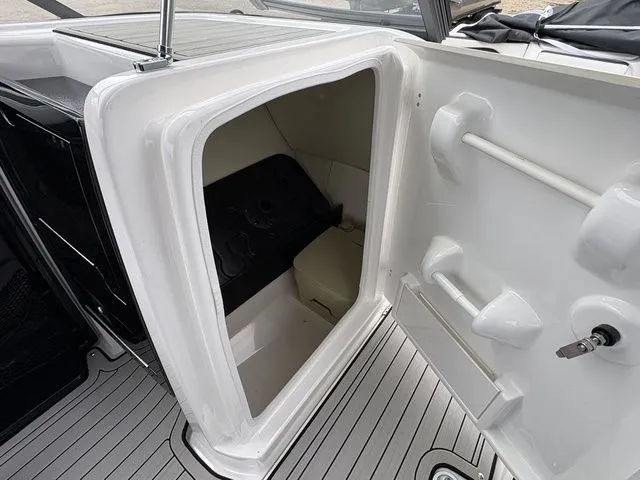 Slide: The Image of Interior of 2020 Yamaha 242 SE Limited with storage compartment. - 21