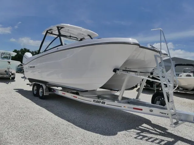 The Image of 2026 Twin Vee 280 GFX2 Dual Console boat on trailer. - 1