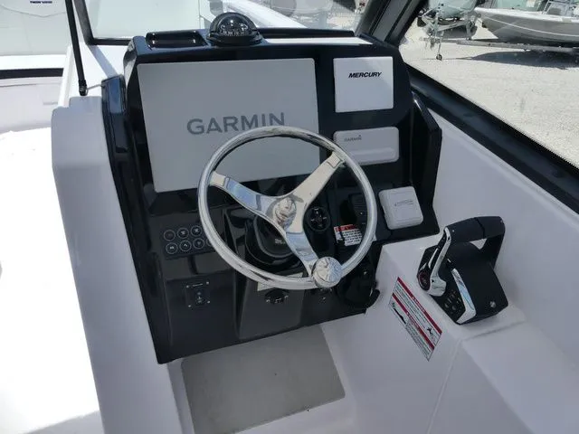 Slide: The Image of Twin Vee 280 GFX2 Dual Console 2026 helm with Garmin navigation system. - 10
