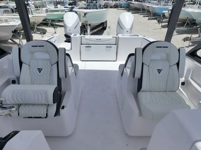 Slide: The Image of Interior of the 2026 Twin Vee 280 GFX2 Dual Console boat. - 17
