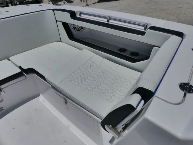 Slide: The Image of Interior of Twin Vee 280 GFX2 Dual Console 2026 with white seating area. - 19
