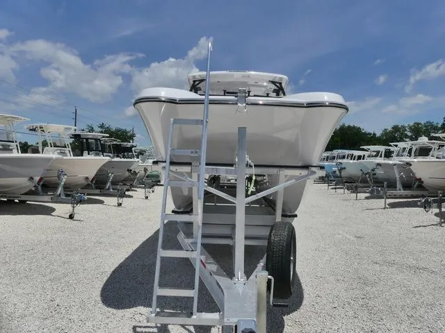 Slide: The Image of 2026 Twin Vee 280 GFX2 Dual Console on trailer, front view. - 3