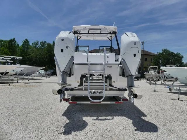 Slide: The Image of Rear view of Twin Vee 280 GFX2 Dual Console boat, 2026 model. - 4