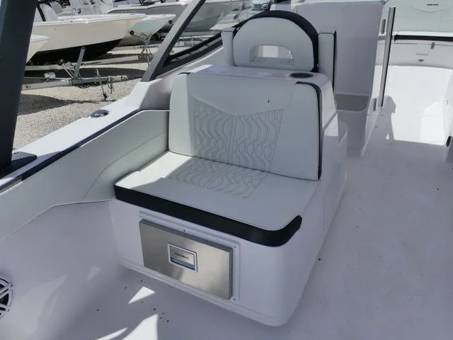 Slide: The Image of Interior of 2026 Twin Vee 280 GFX2 DUAL CONSOLE with white seating. - 8