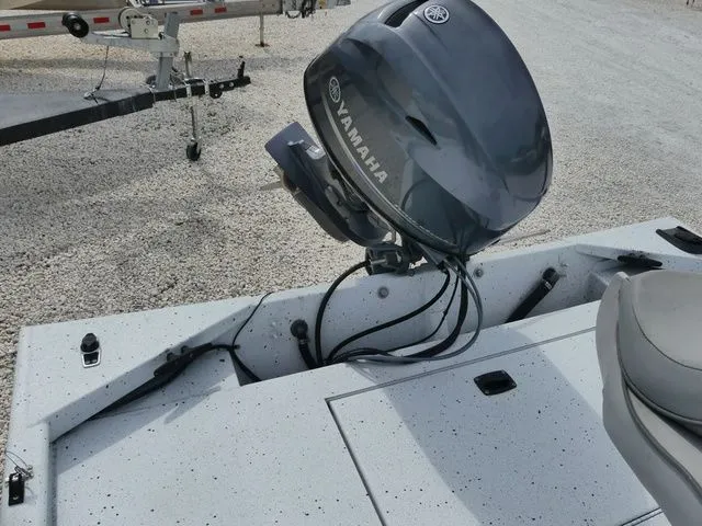 Slide: The Image of 2021 Xpress Boats XP18CC with Yamaha motor on gravel surface. - 6
