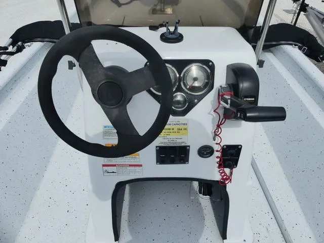 Slide: The Image of 2021 Xpress Boats XP18CC steering console with wheel and gauges. - 9