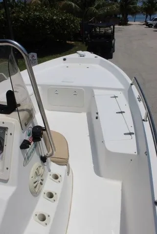 Slide: The Image of 2001 Sea Pro 2100 SV boat, white deck, coastal background. - 11