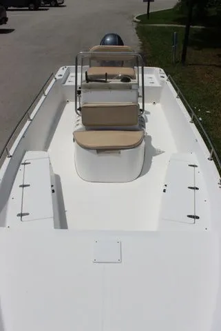 Slide: The Image of 2001 Sea Pro 2100 SV boat with white deck and seating area. - 12