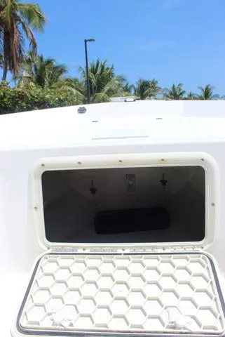 Slide: The Image of Open storage compartment of a 2001 Sea Pro 2100 SV boat. - 24