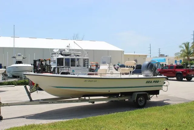 Slide: The Image of 2001 Sea Pro 2100 SV boat on trailer outdoors. - 3