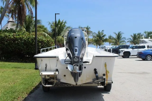 Slide: The Image of 2001 Sea Pro 2100 SV boat on trailer, palm trees in background. - 5