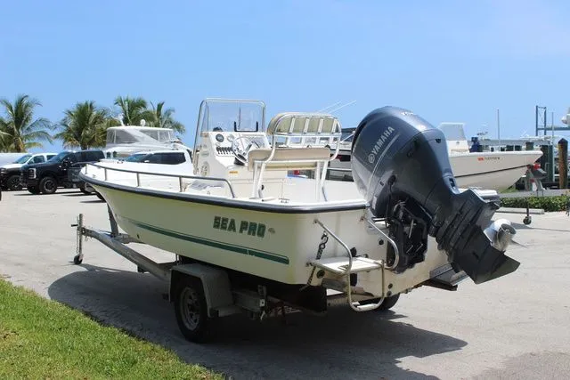 Slide: The Image of 2001 Sea Pro 2100 SV boat on trailer, outboard motor. - 6