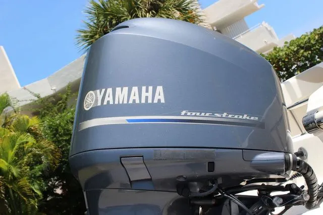 Slide: The Image of Yamaha four-stroke outboard motor on 2014 Pioneer 222 Sportfish. - 11