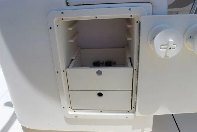 Slide: The Image of Storage compartment in 2014 Pioneer 222 Sportfish boat. - 15