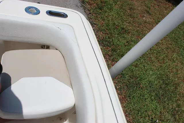 Slide: The Image of Pioneer 222 Sportfish 2014 seating area with white upholstery. - 18