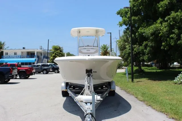 Slide: The Image of 2014 Pioneer 222 Sportfish boat on trailer, sunny day. - 2