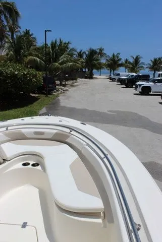 Slide: The Image of Pioneer 222 Sportfish 2014 on parking lot with palm trees and ocean view. - 22