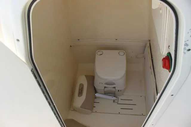 Slide: The Image of Interior of 2014 Pioneer 222 Sportfish featuring a toilet. - 26