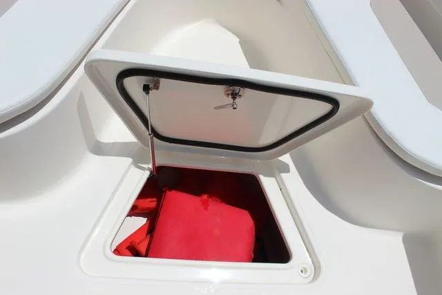 Slide: The Image of Open storage compartment on a 2014 Pioneer 222 Sportfish boat. - 30